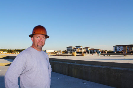 Chris "Big Dog" Rutherford, site manager for Blalock Construction, standing in auditorium #3 in early November.