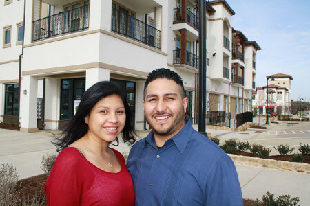 Orlando Rojas with wife near the storefront for The Lodge Barbershop that is set to open in April. 