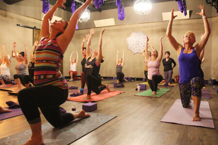 The yoga studio features far infrared heat and accommodates 27 mats with room to spare. 